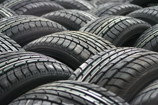Stacked new car tyres